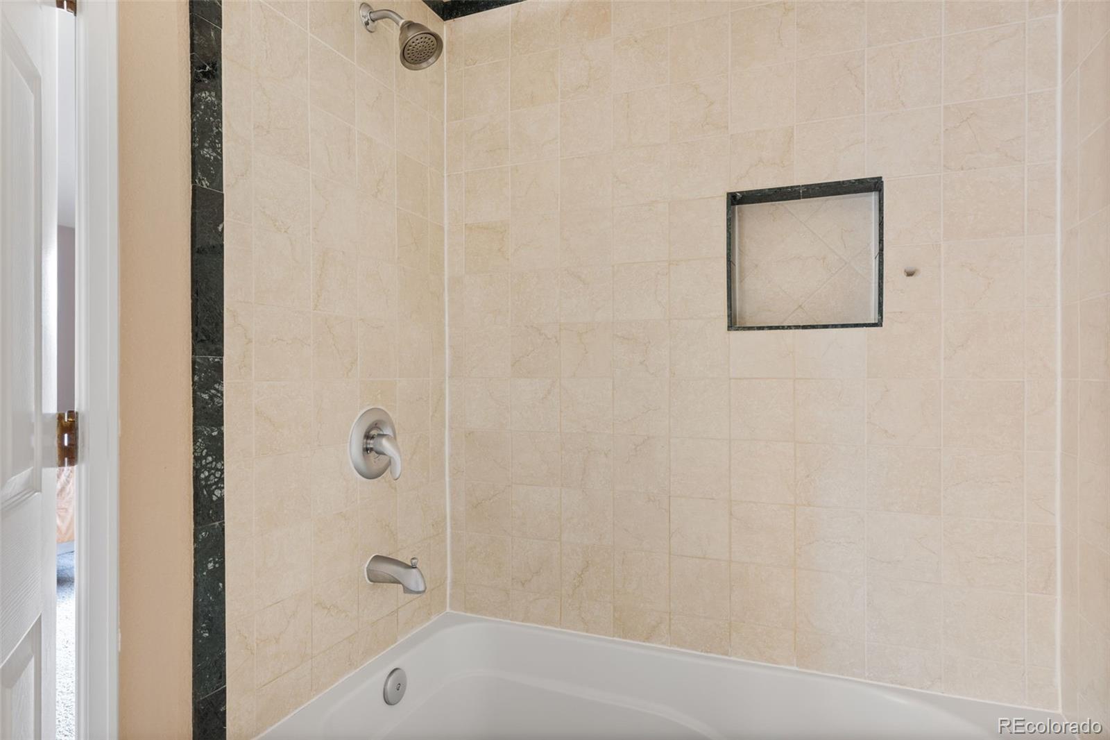 1189 Fall River Circle Longmont, CO 80504 - Photo 25 of 46 a bathroom with a shower