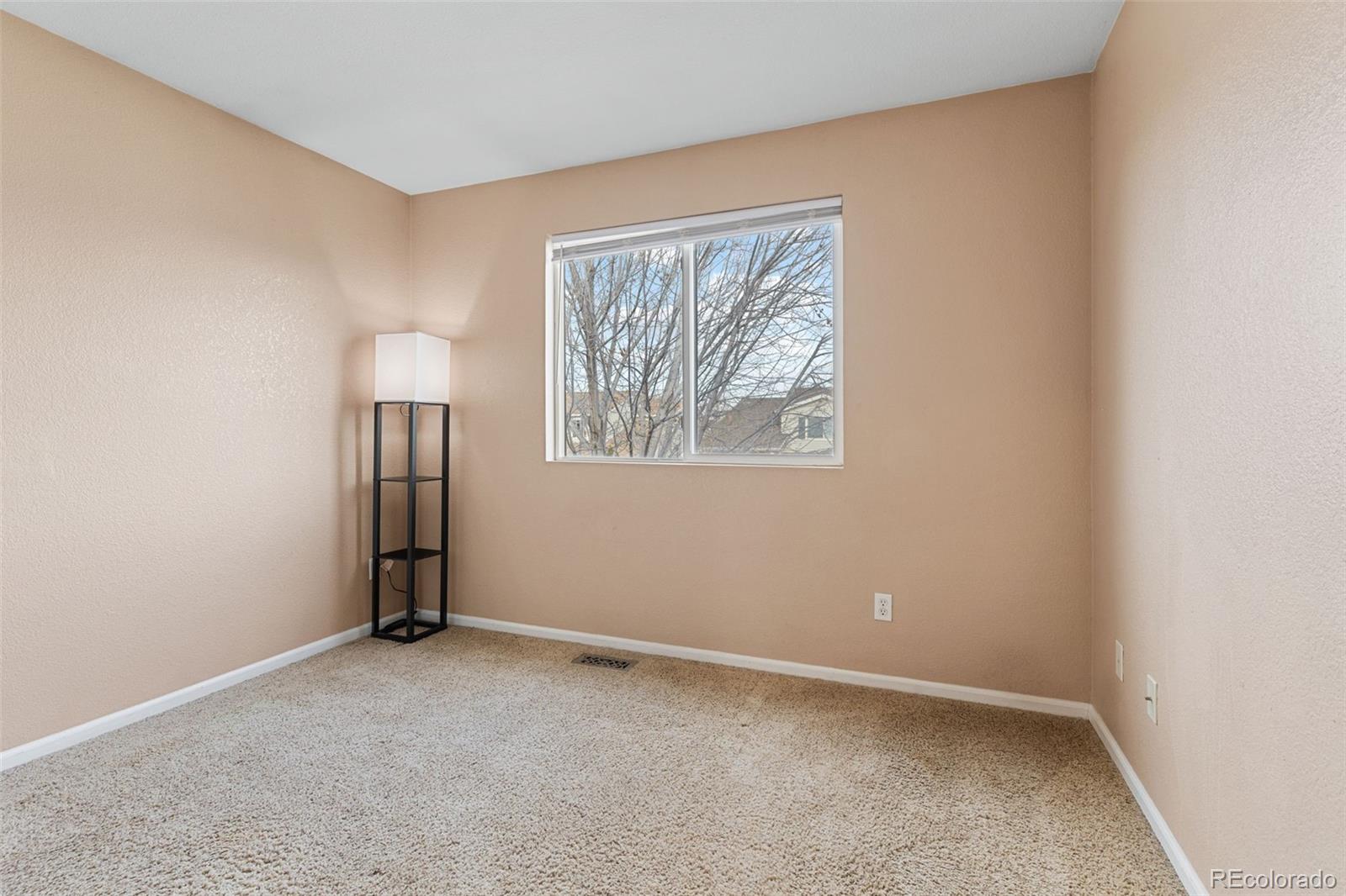 1189 Fall River Circle Longmont, CO 80504 - Photo 26 of 46 an empty room with windows and closet