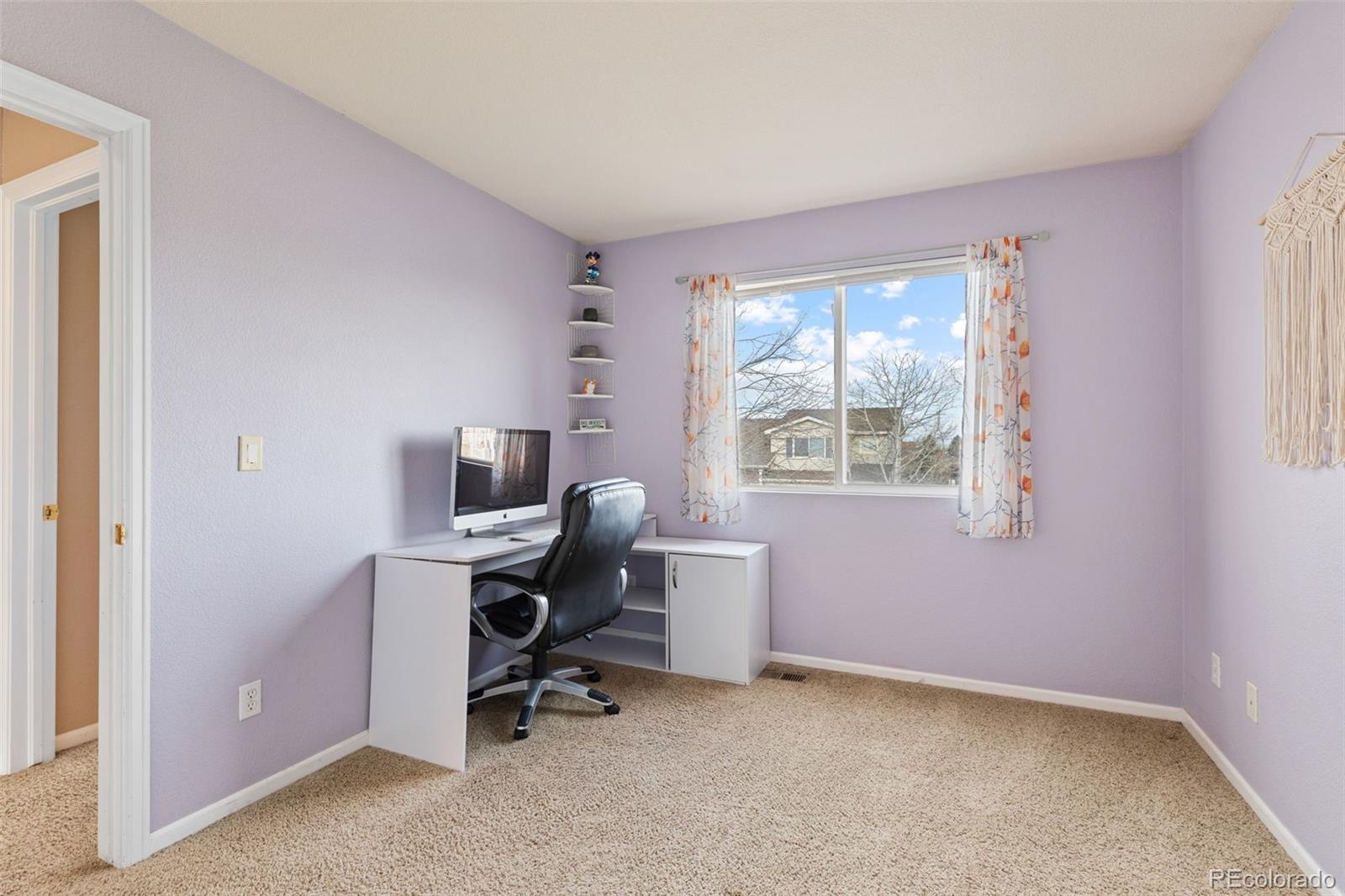 1189 Fall River Circle Longmont, CO 80504 - Photo 30 of 46 a view of a workspace with furniture and a window
