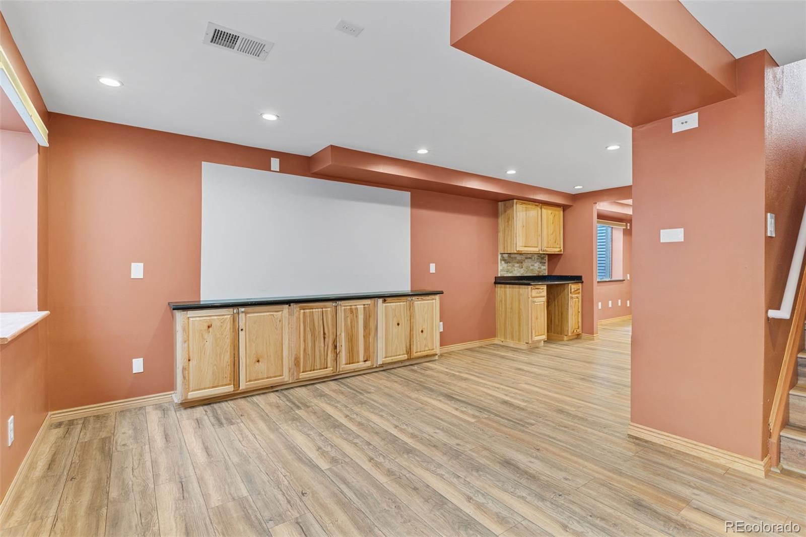 1189 Fall River Circle Longmont, CO 80504 - Photo 31 of 46 a view of an empty room with wooden floor