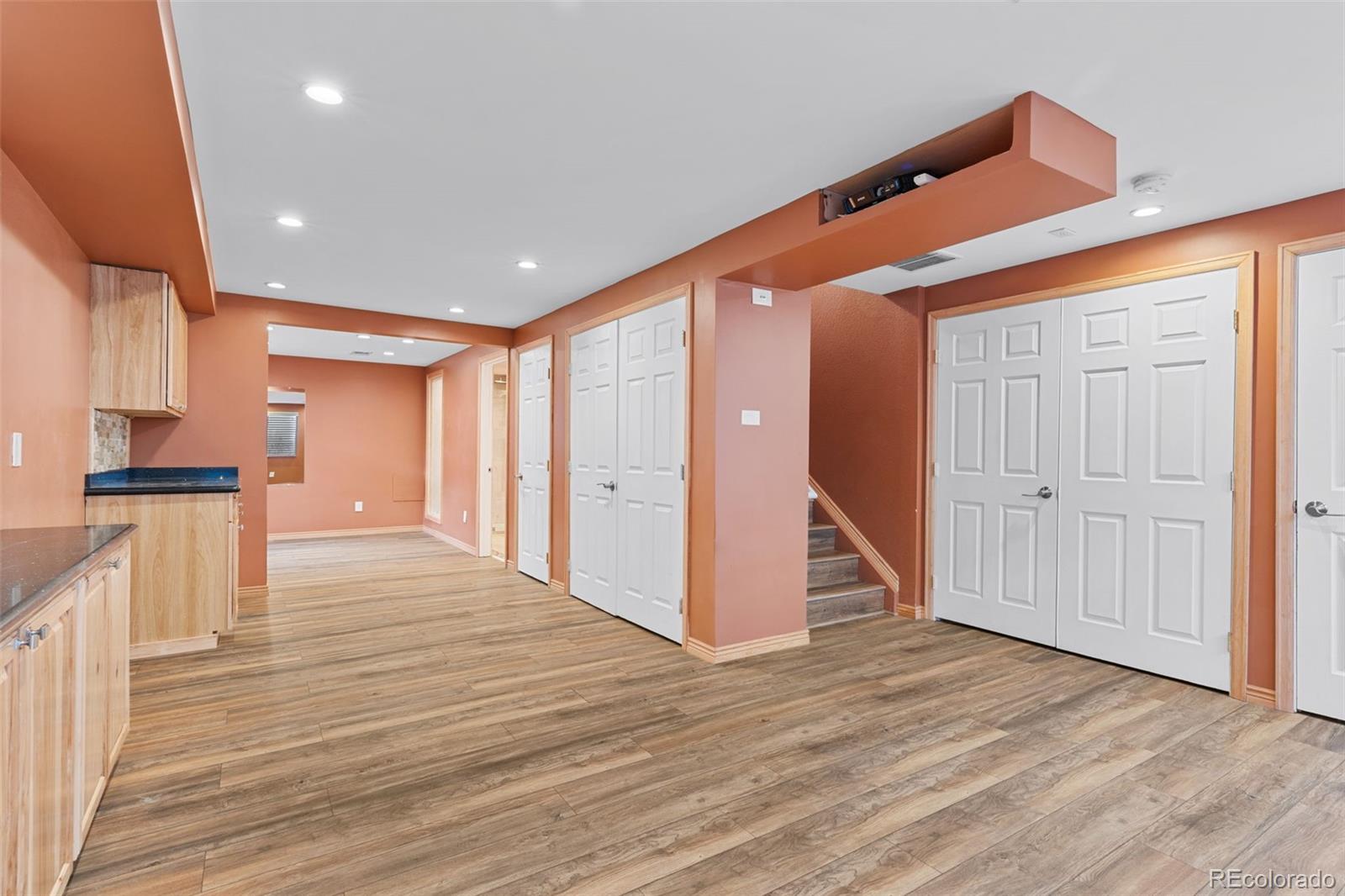 1189 Fall River Circle Longmont, CO 80504 - Photo 32 of 46 a view of a kitchen with wooden floor and a stairs