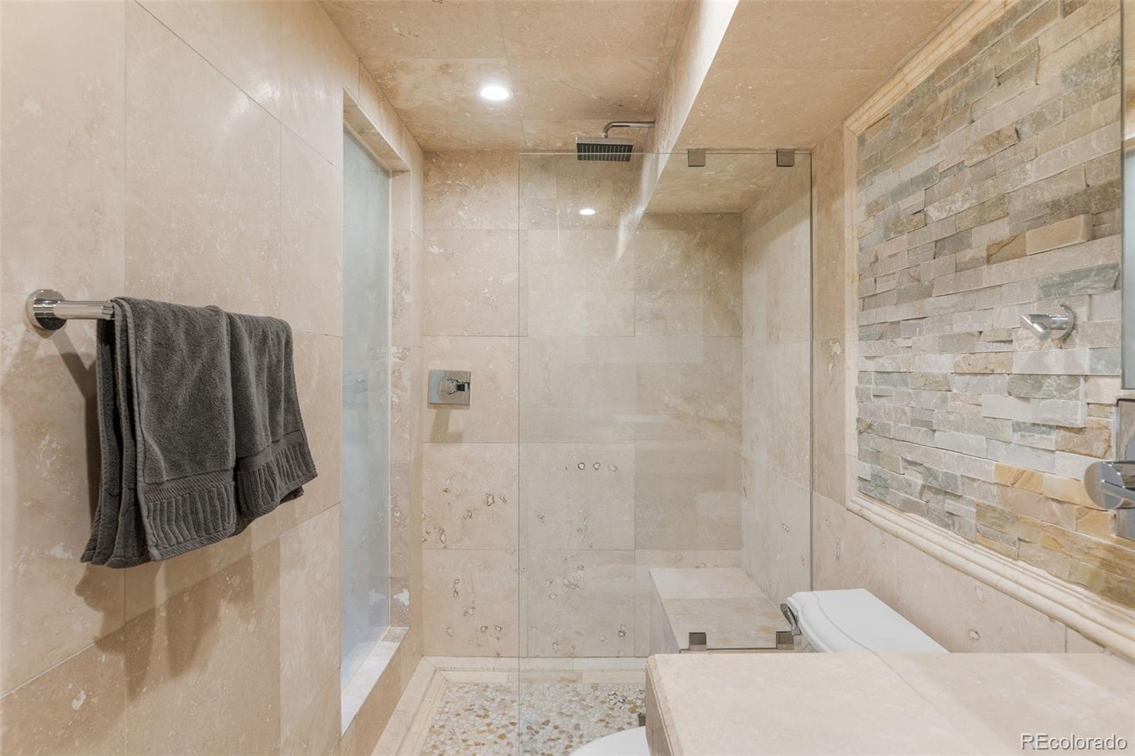 1189 Fall River Circle Longmont, CO 80504 - Photo 36 of 46 a bathroom with a shower and a tub