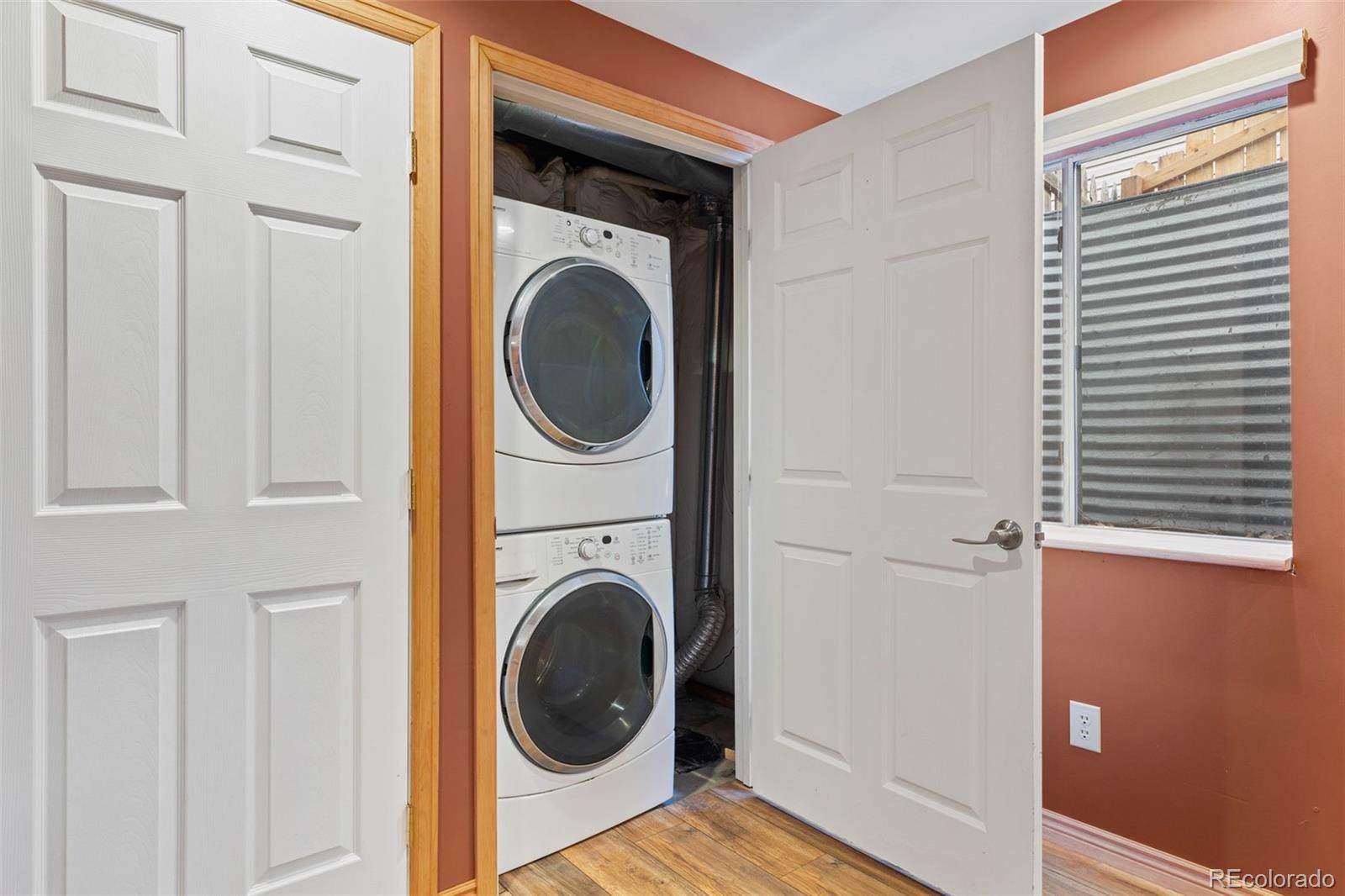 1189 Fall River Circle Longmont, CO 80504 - Photo 37 of 46 a view of a hallway with washer and dryer