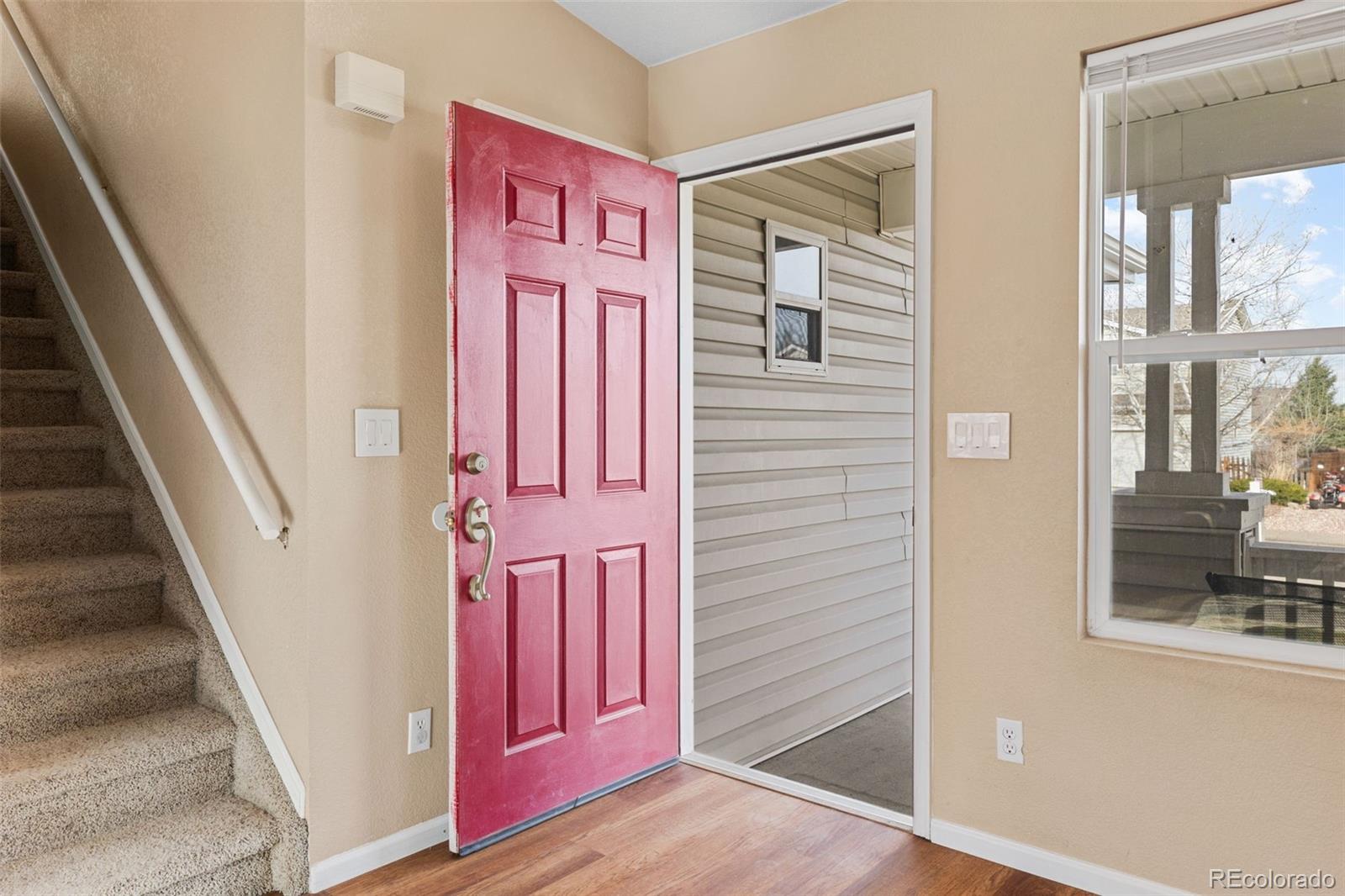 1189 Fall River Circle Longmont, CO 80504 - Photo 4 of 46 a view of a front door of the house