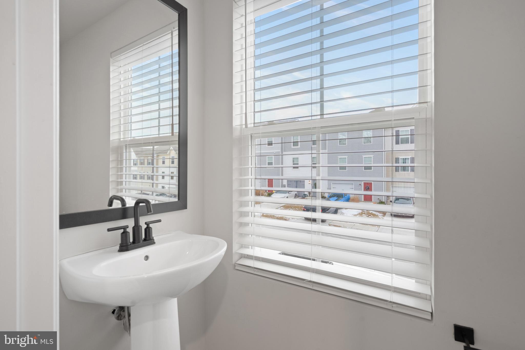 51 Thrower Road Hedgesville, WV 25427 - Photo 20 of 38 a bathroom with a sink and a window