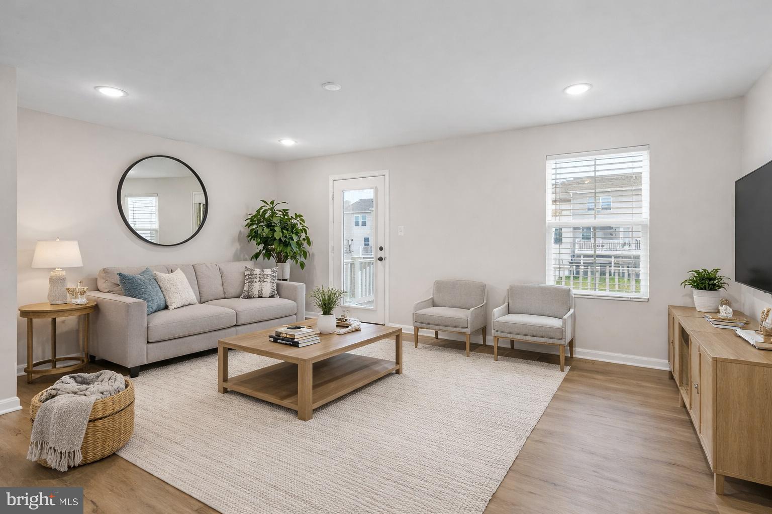51 Thrower Road Hedgesville, WV 25427 - Photo 4 of 38 a living room with furniture a flat screen tv and a large window