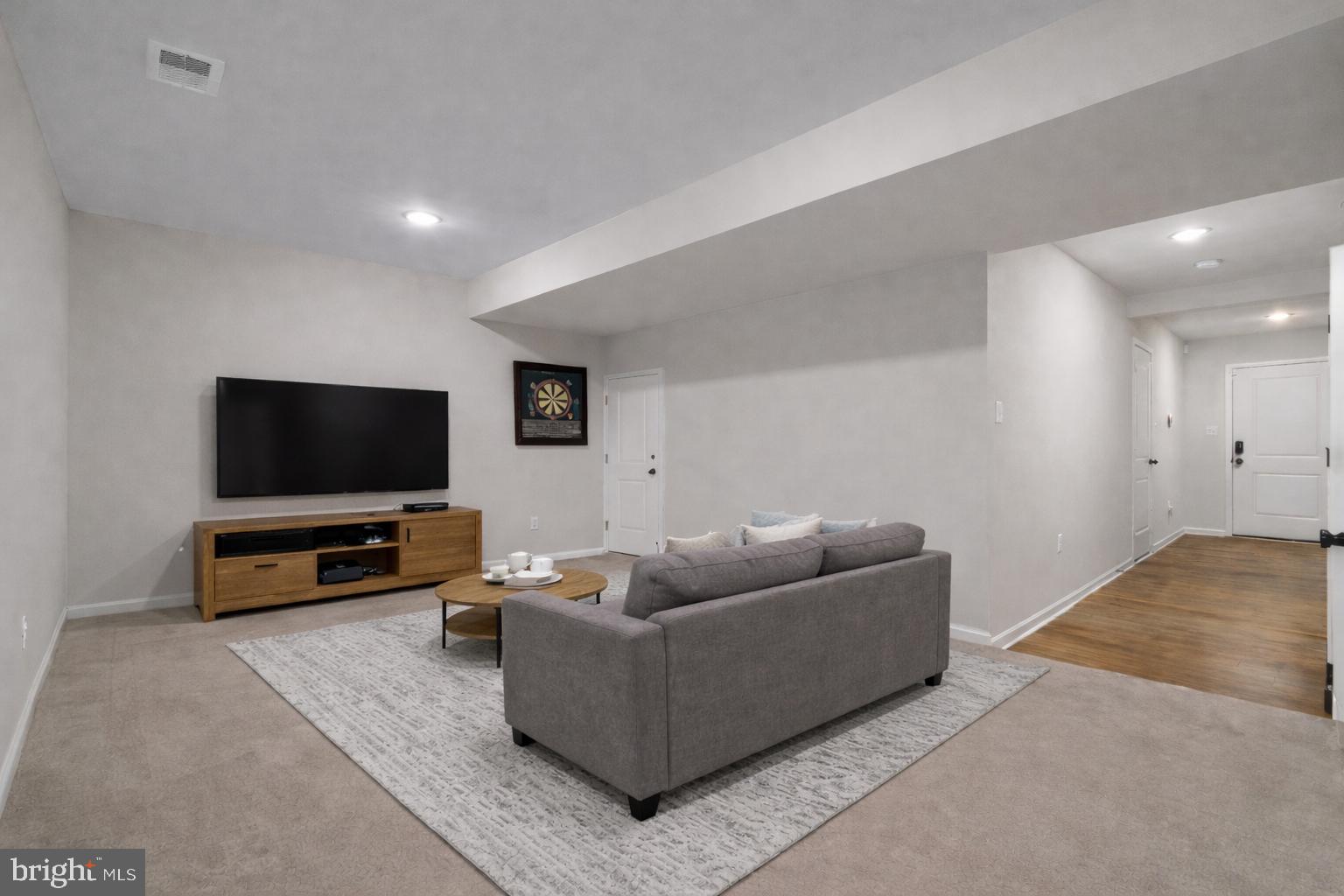 51 Thrower Road Hedgesville, WV 25427 - Photo 6 of 38 a living room with furniture and a flat screen tv