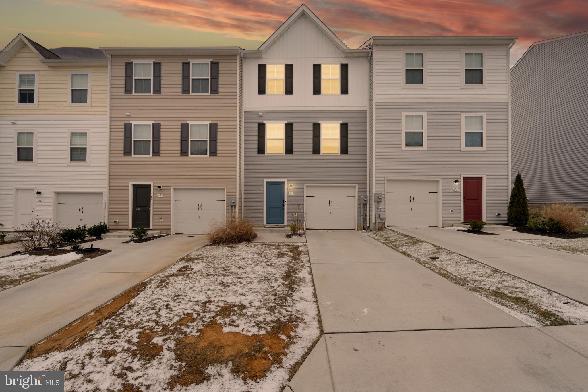 51 Thrower Road Hedgesville, WV 25427 - Photo 7 of 38 a front view of a house with a snow on the road