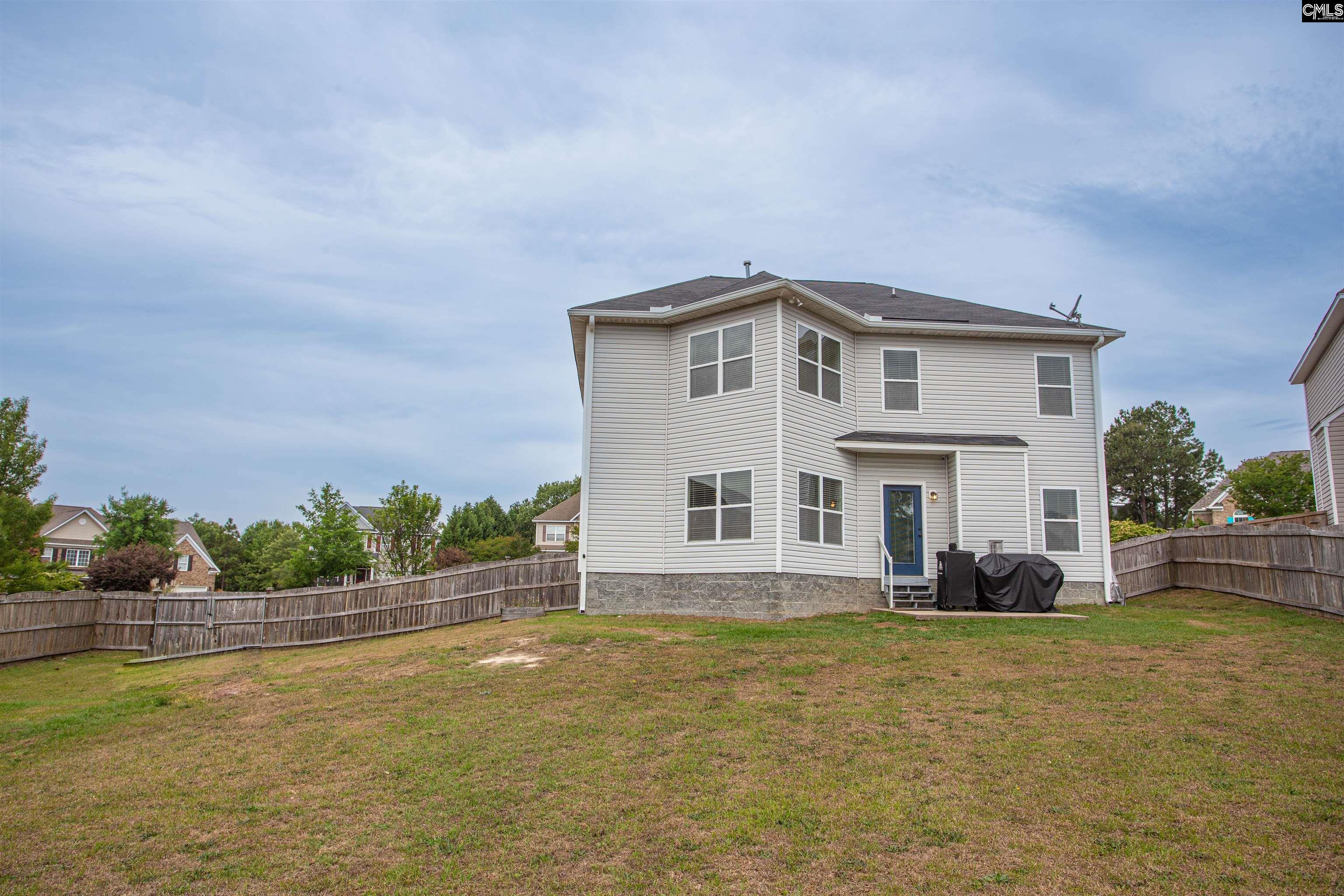 7 Templand Court Elgin, SC 29045 - Photo 46 of 47 a front view of a house with a yard
