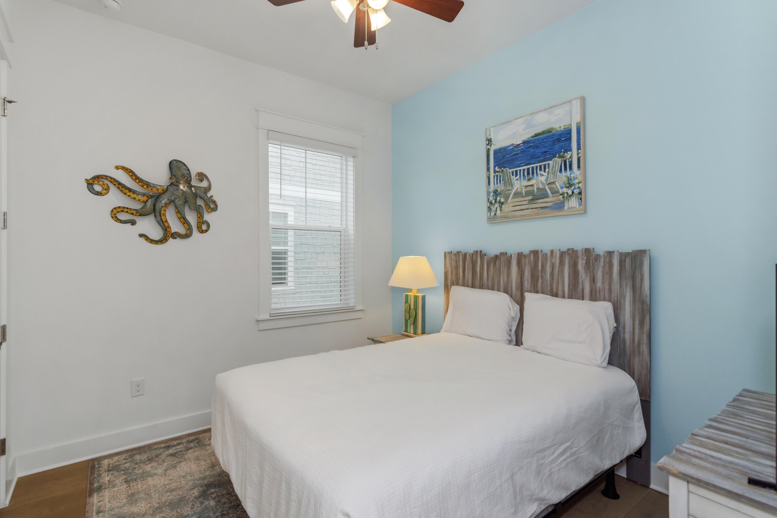 259 Milestone Dr Inlet Beach, Unit A Inlet Beach, FL 32461 - Photo 17 of 31 a bedroom with a bed and a painting on the wall