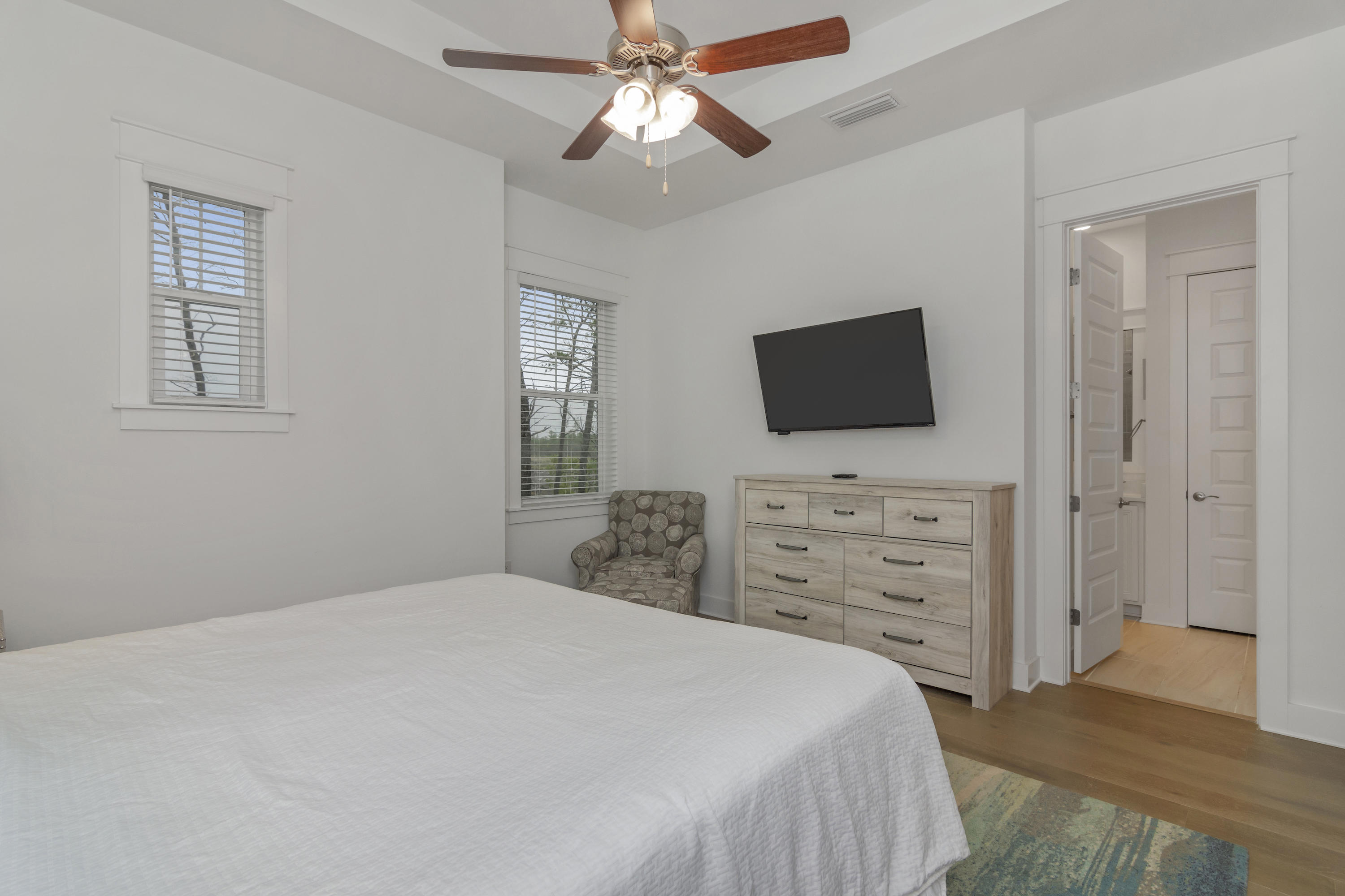 259 Milestone Dr Inlet Beach, Unit A Inlet Beach, FL 32461 - Photo 24 of 31 a bedroom with a bed and a flat screen tv