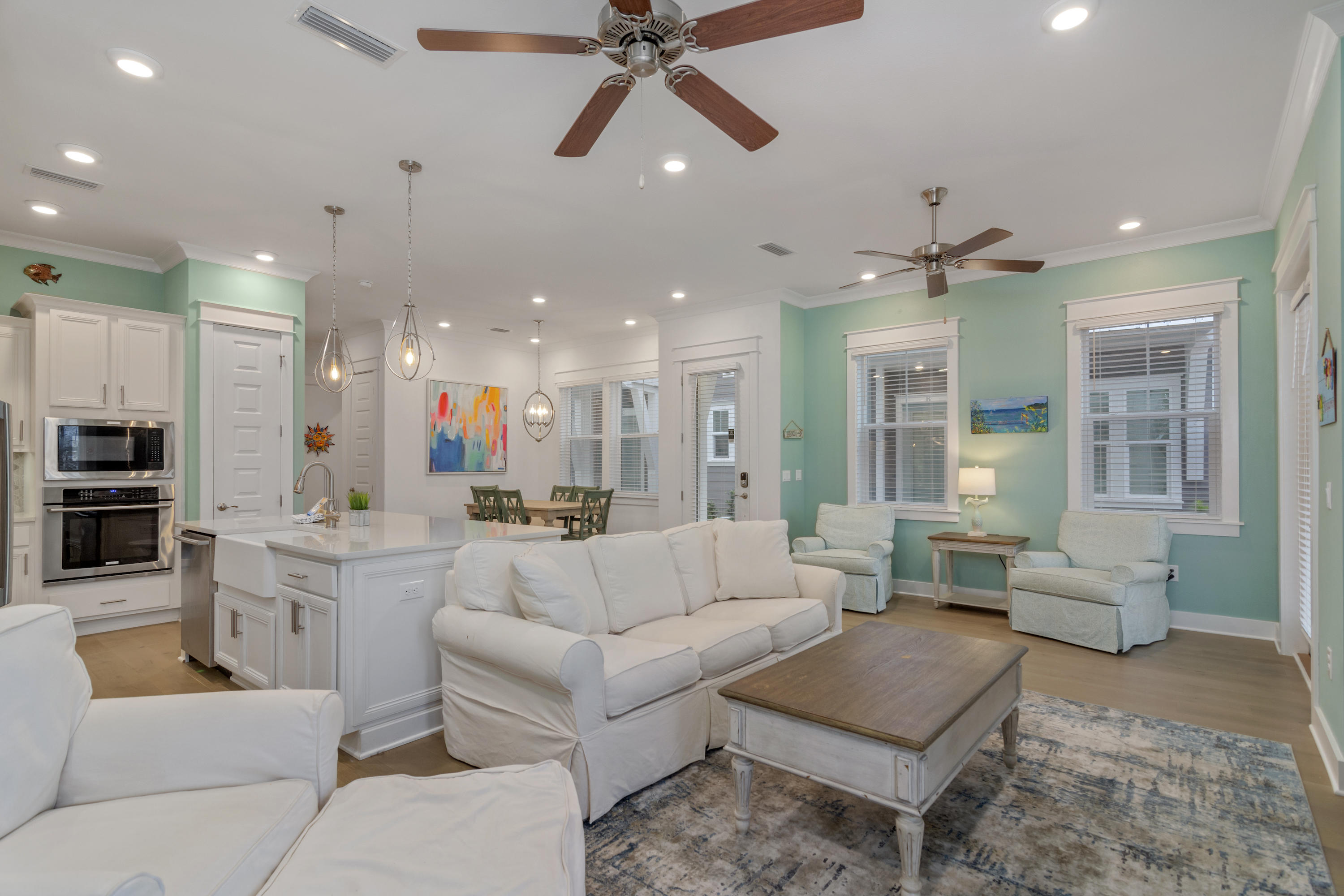 259 Milestone Dr Inlet Beach, Unit A Inlet Beach, FL 32461 - Photo 3 of 31 a living room with furniture kitchen view and a chandelier