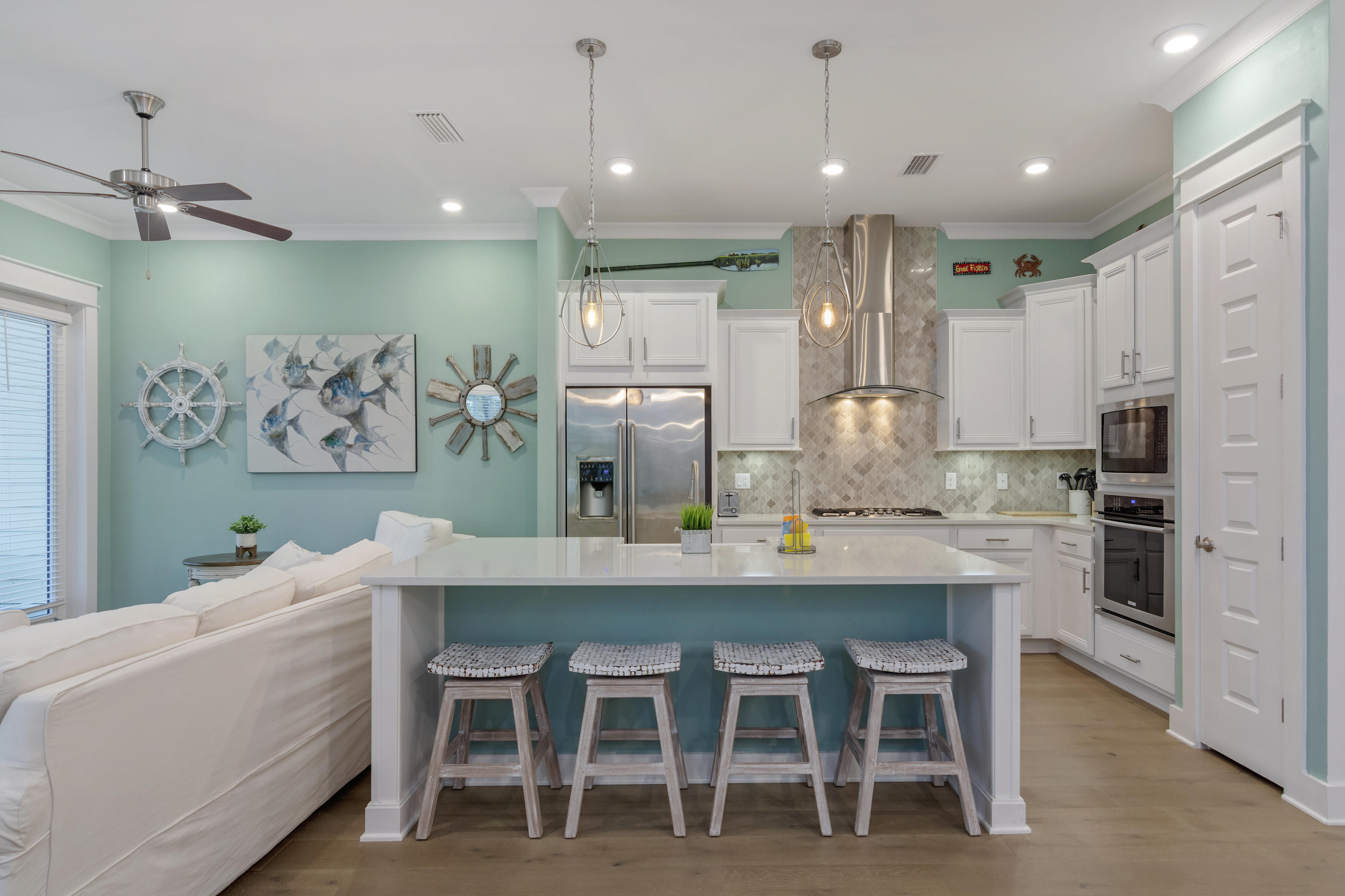 259 Milestone Dr Inlet Beach, Unit A Inlet Beach, FL 32461 - Photo 6 of 31 a kitchen with kitchen island a table and chairs in it