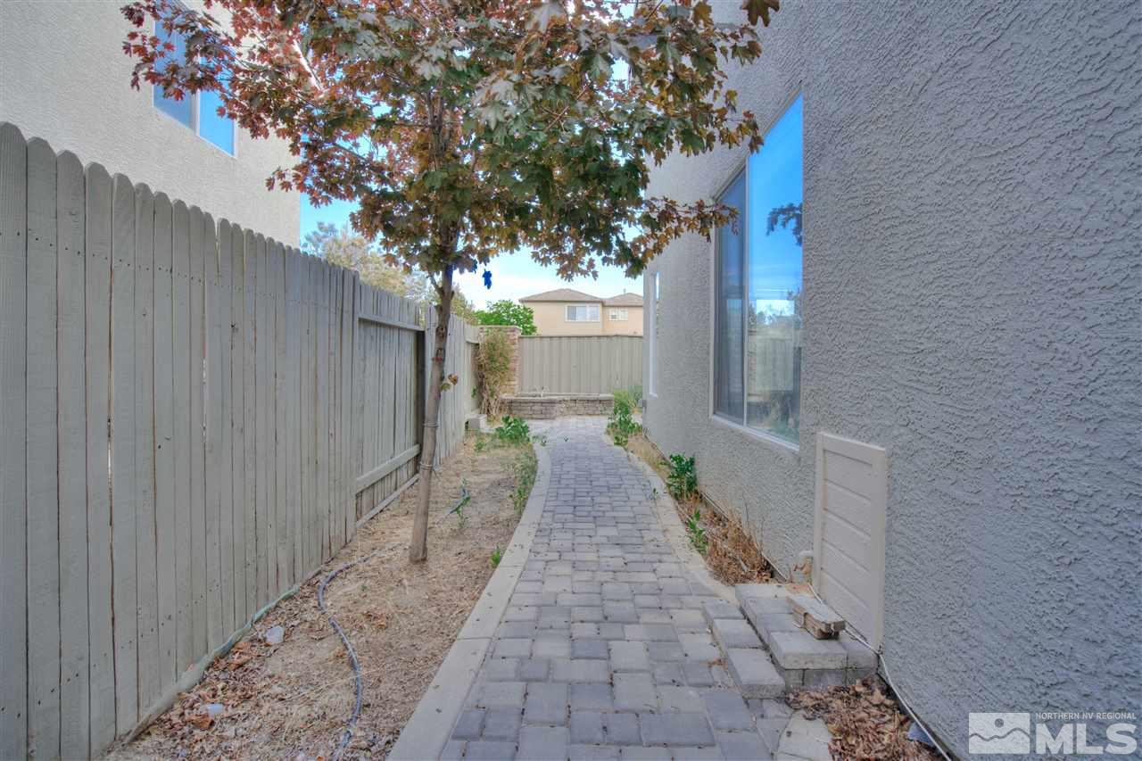 10490 Chadwell Drive Reno, NV 89521 - Photo 36 of 36 a view of a pathway with a white house