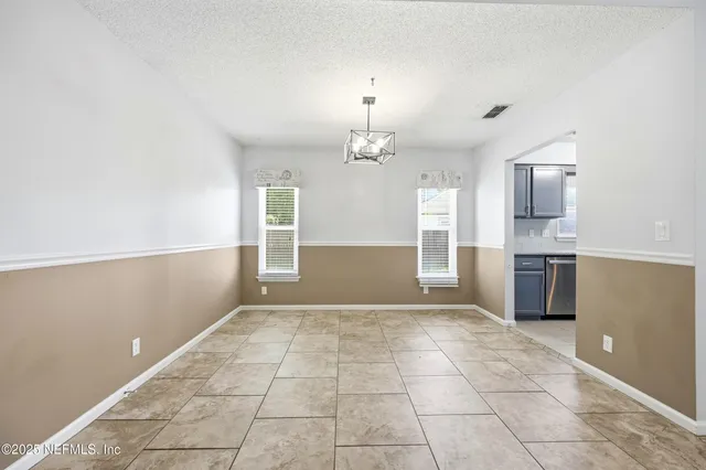 a view of a kitchen with a sink and cabinet area
