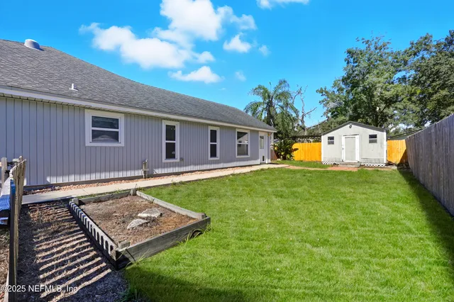 a view of a backyard with a garden