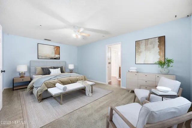 a bedroom with a bed and furniture