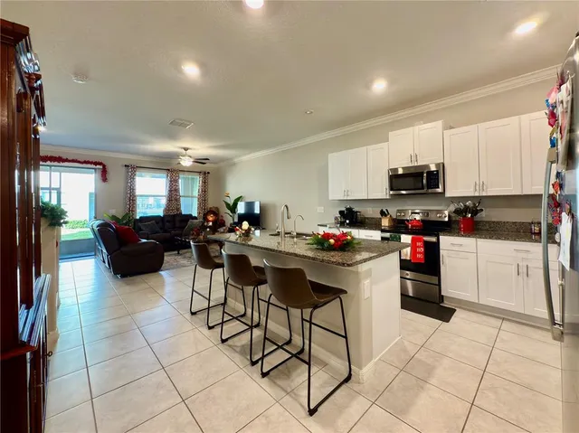 an aerial view of a house with a swimming pool yard and outdoor seating