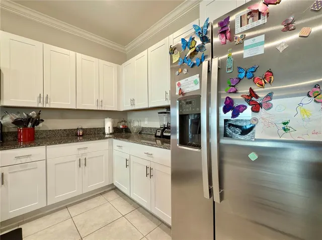 a view of a patio with a table and chairs under an umbrella