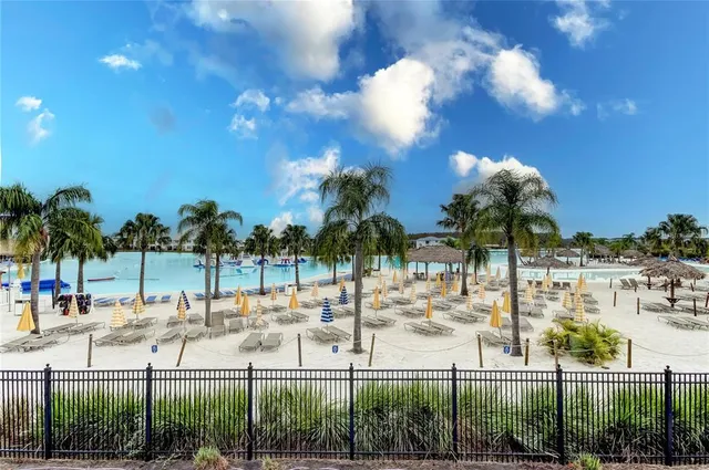 a kitchen with stainless steel appliances kitchen island granite countertop a refrigerator and a sink