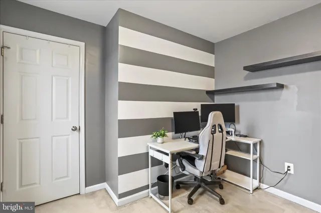 a view of a workspace with furniture