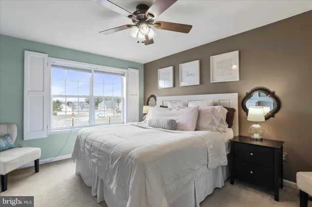 a bedroom with a bed and window