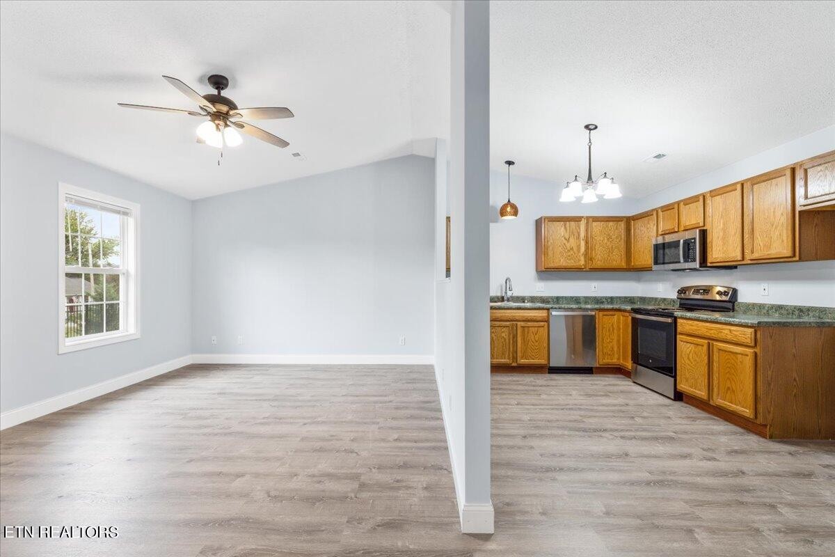 731 High Point Way, Knoxville, TN 37912 - Photo 15 of 25 a view of a kitchen with a sink cabinets and wooden floor