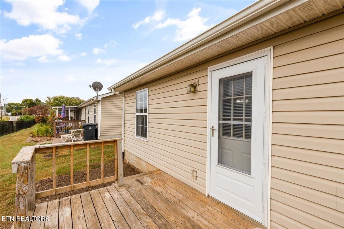 731 High Point Way, Knoxville, TN 37912 - Photo 23 of 25 a view of a balcony with wooden floor and fence