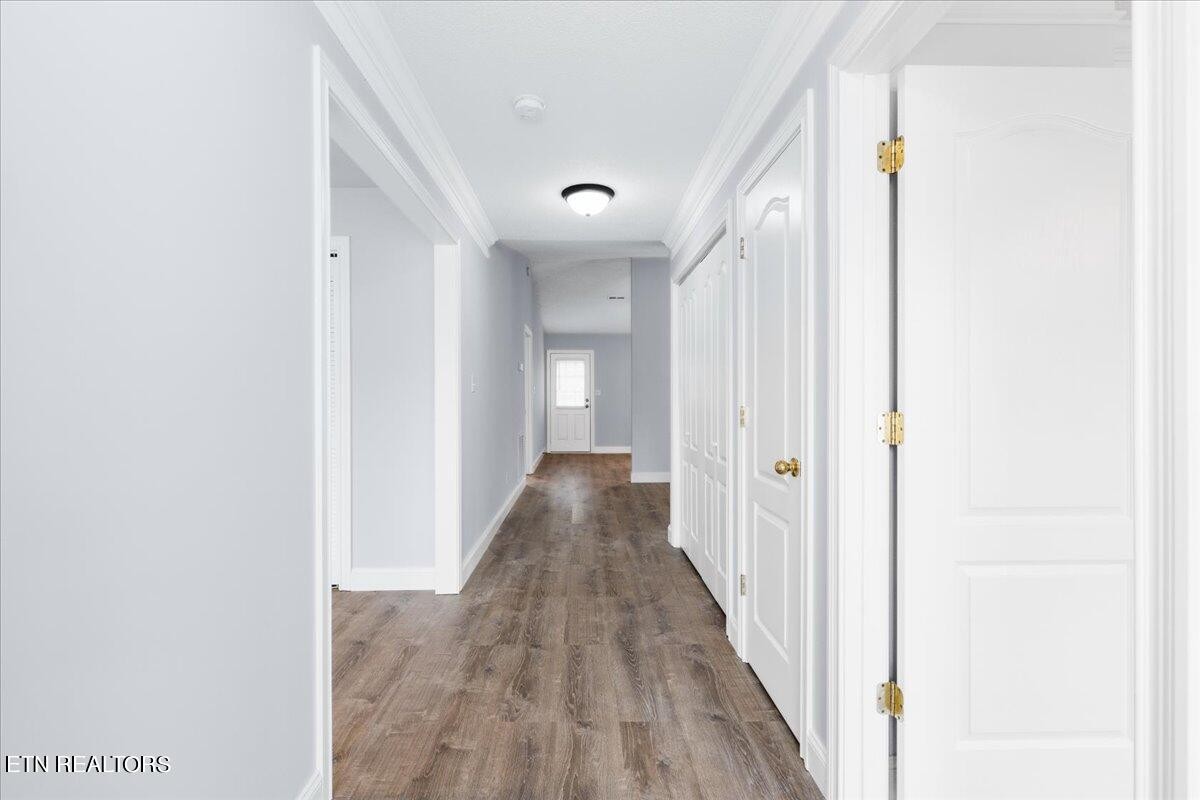 731 High Point Way, Knoxville, TN 37912 - Photo 4 of 25 a view of a hallway with wooden floor