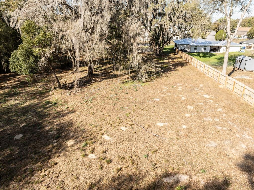 100 South Old Wire Road Wildwood, FL 34785 - Photo 6 of 16 a view of a yard with yellow benches