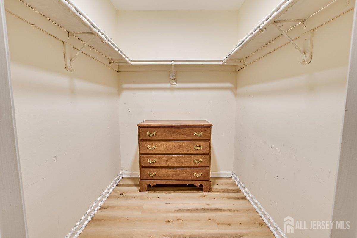 5001 Stonehedge Road Edison, NJ 08820 - Photo 16 of 22 a view of walk in closet