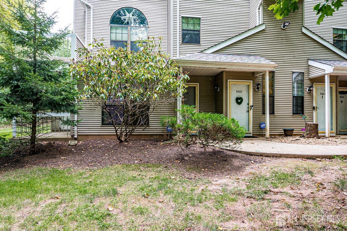 5001 Stonehedge Road Edison, NJ 08820 - Photo 2 of 22 a front view of a house with garden