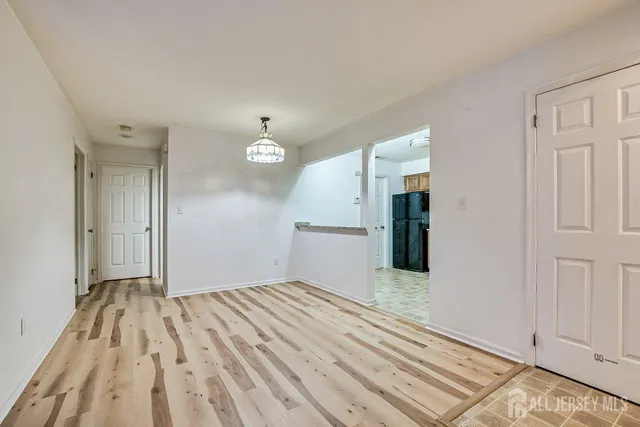 wooden floor in a hall with an entryway