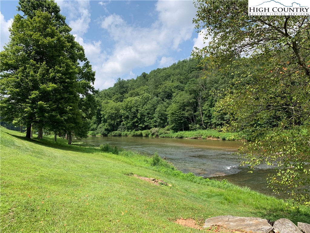 Lot 3 Skye Ridge Drive West Jefferson, NC 28694 - Photo 17 of 17 a yard with trees in the background