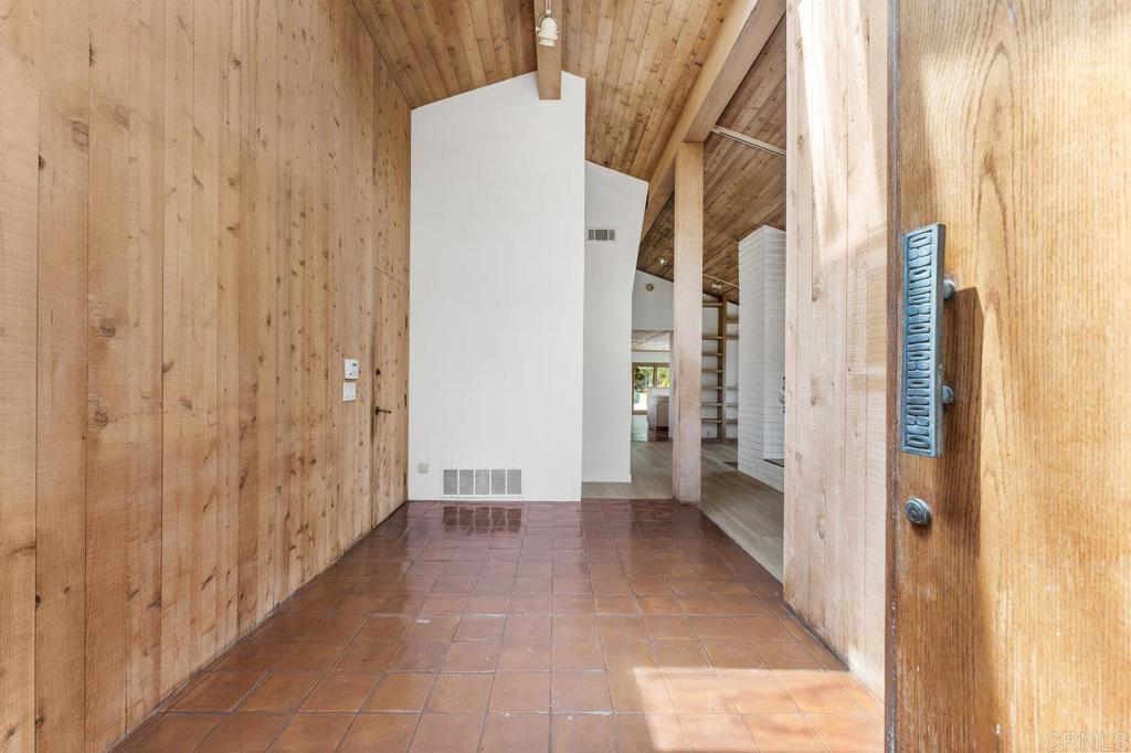 7675 Via Capri La Jolla, CA 92037 - Photo 14 of 75 a view of a bathroom with a shower and a door