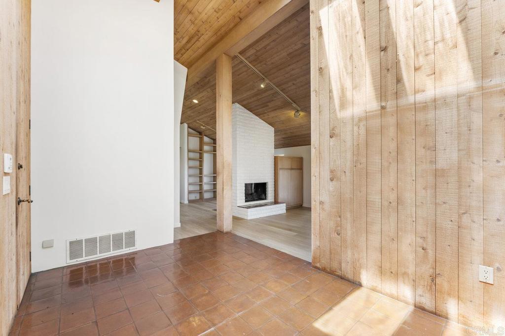 7675 Via Capri La Jolla, CA 92037 - Photo 15 of 75 a view of a hallway with wooden floor and entryway
