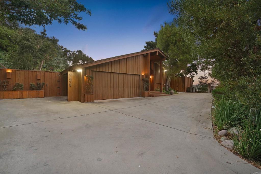 7675 Via Capri La Jolla, CA 92037 - Photo 3 of 75 a view of a house with a garage