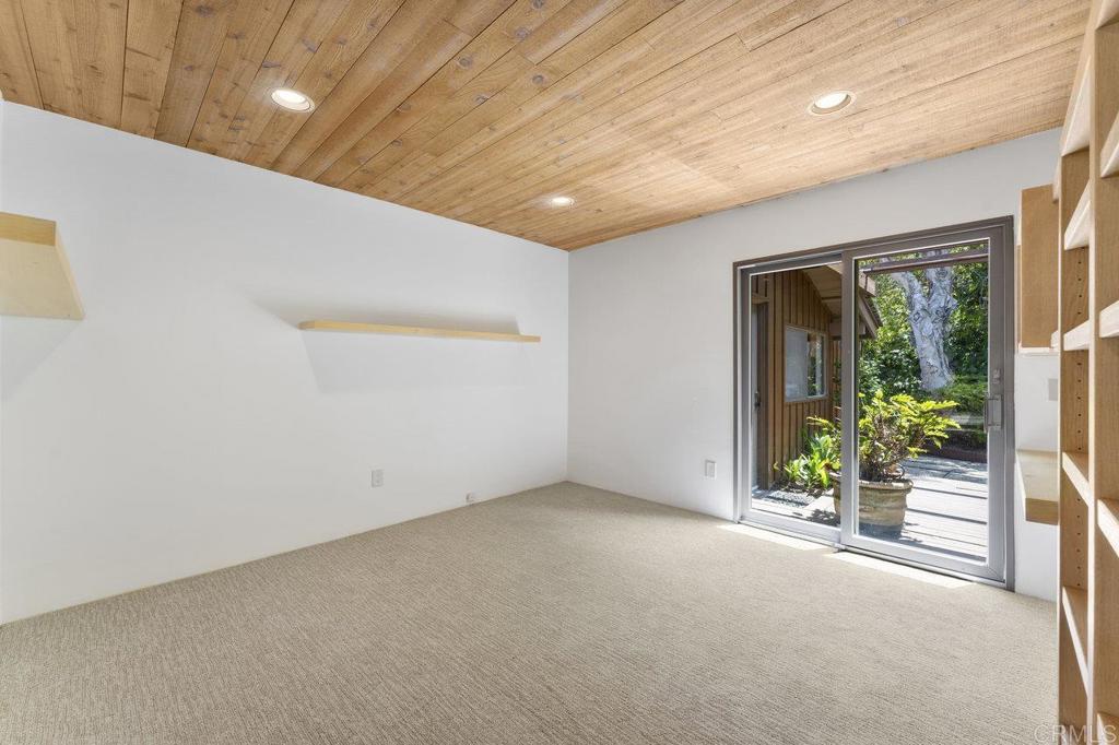 7675 Via Capri La Jolla, CA 92037 - Photo 36 of 75 wooden floor in an empty room with a window