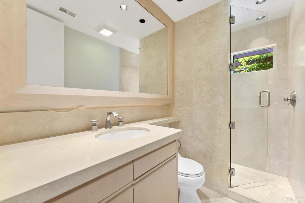 7675 Via Capri La Jolla, CA 92037 - Photo 37 of 75 a bathroom with a sink a toilet and shower