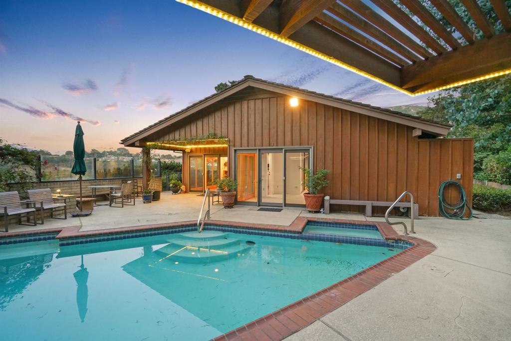7675 Via Capri La Jolla, CA 92037 - Photo 41 of 75 a view of a house with swimming pool and sitting area