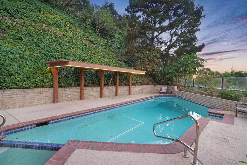 7675 Via Capri La Jolla, CA 92037 - Photo 48 of 75 a view of a backyard with a deck and a garden