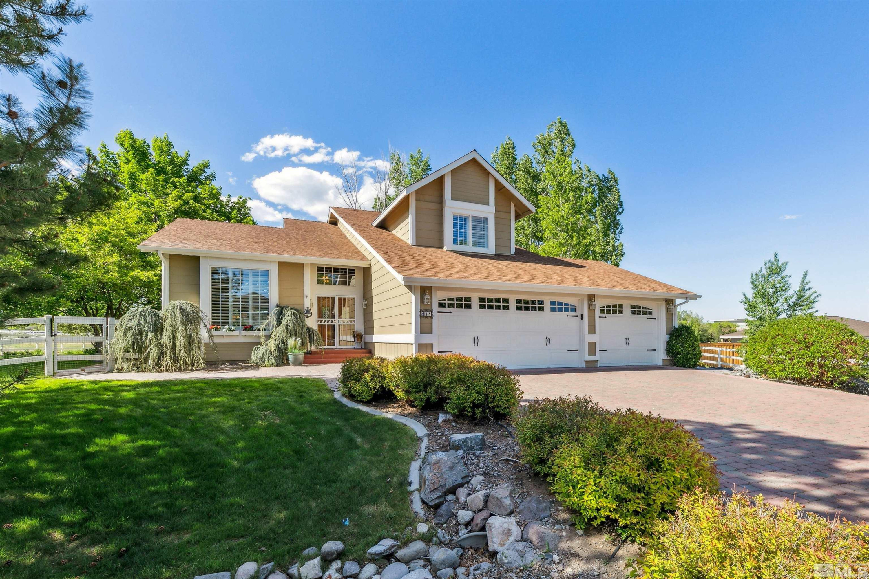 971 Country Estates Circle Reno, NV 89511 - Photo 4 of 40 a front view of a house with a yard