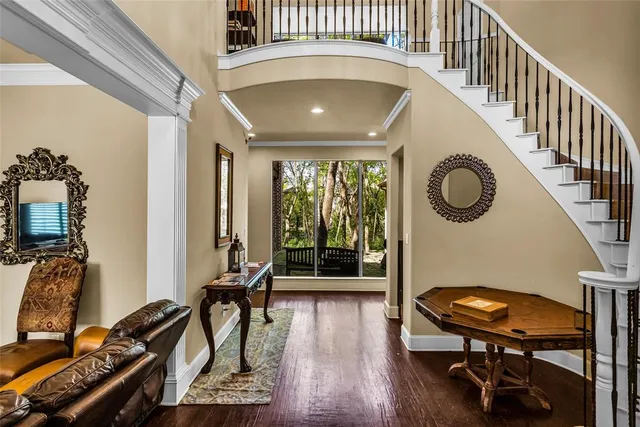 a view of a livingroom with furniture and hardwood floor
