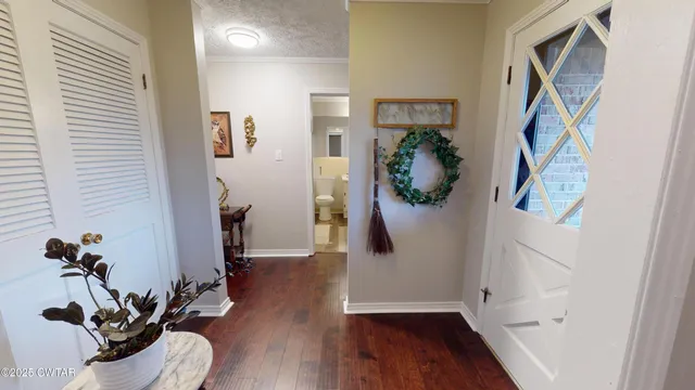 a living room with furniture and a book shelf
