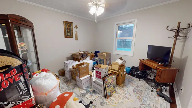 an aerial view of a house with yard and trees