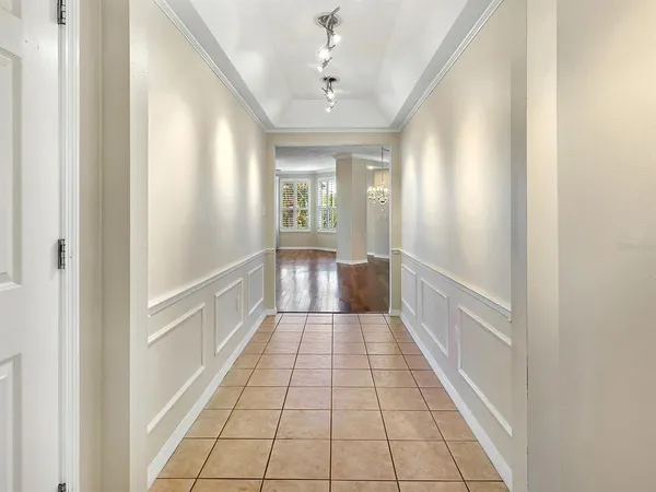 a hallway with sliding door and entryway