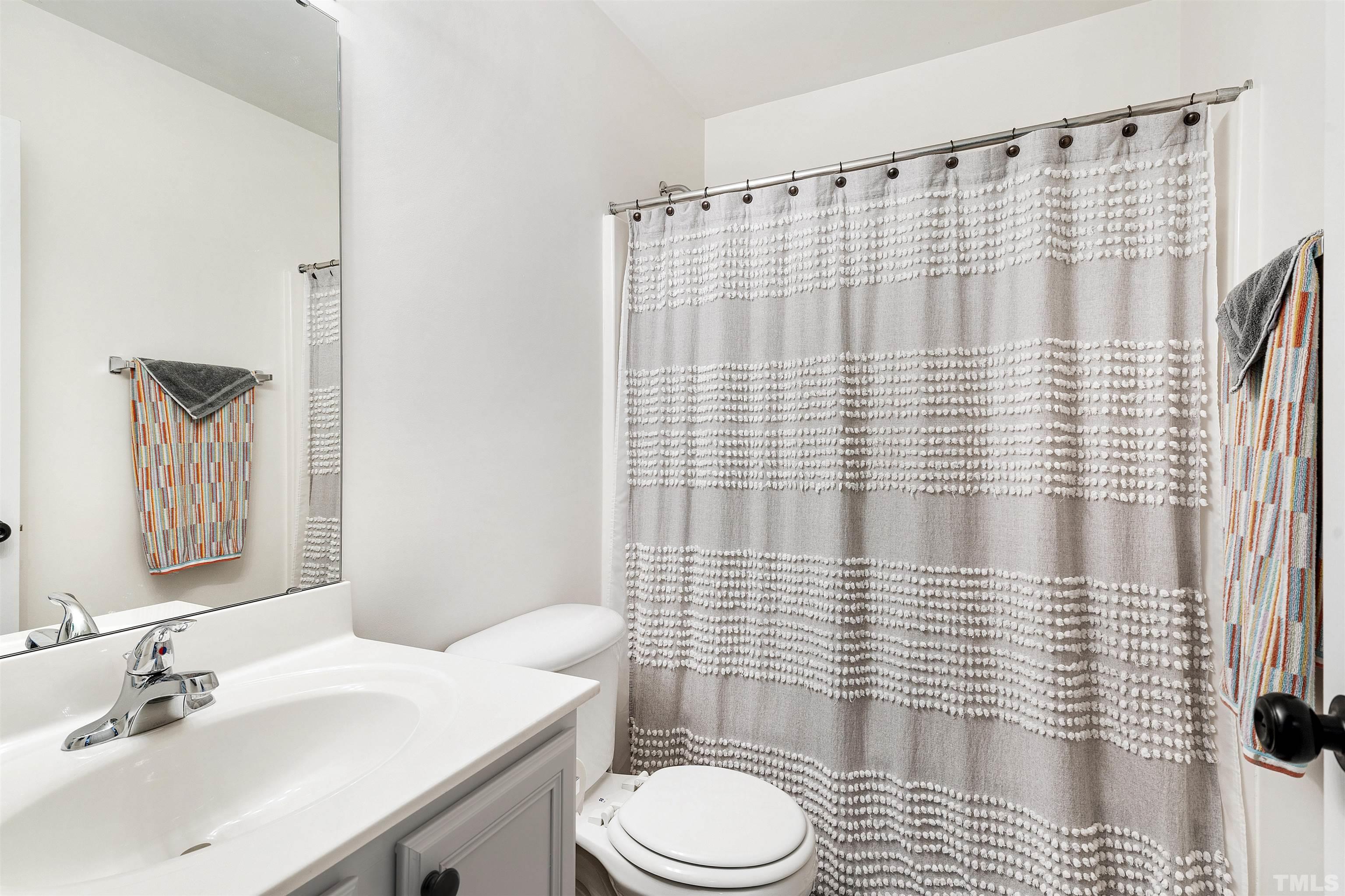 2704 Andover Glen Road Raleigh, NC 27604 - Photo 25 of 30 a bathroom with a sink toilet and shower