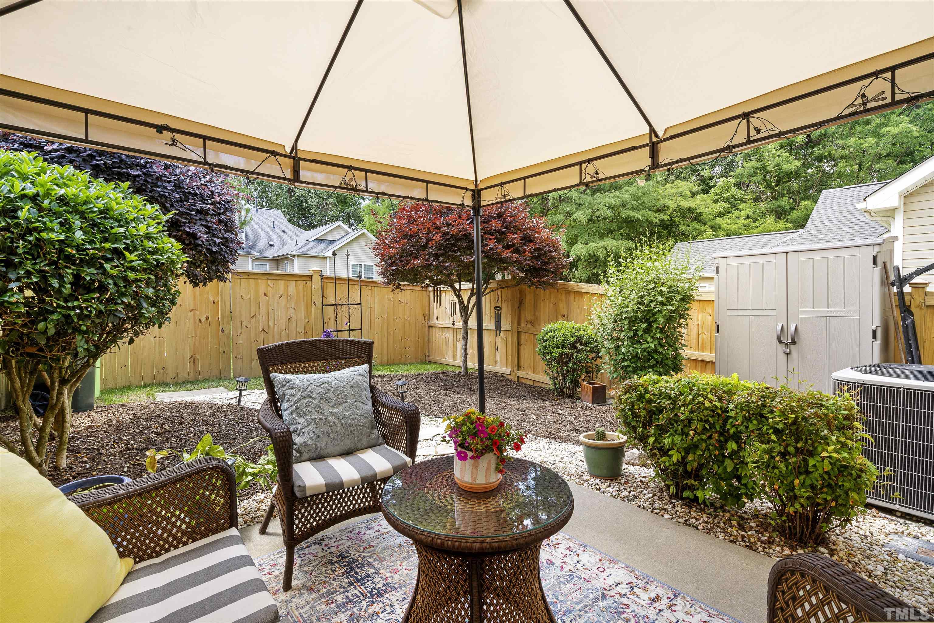 2704 Andover Glen Road Raleigh, NC 27604 - Photo 27 of 30 a view of a chairs and table in the backyard