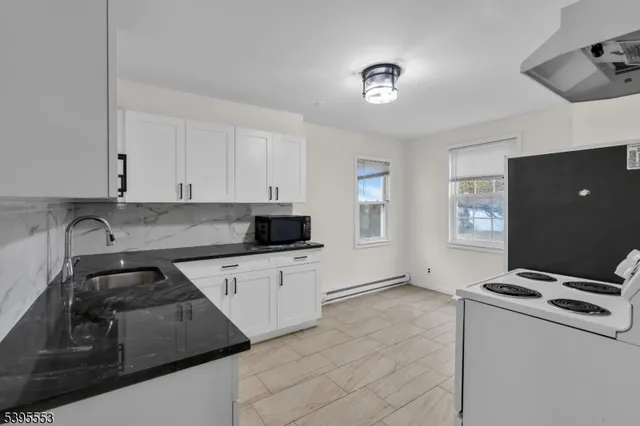 a kitchen that has a sink and a stove