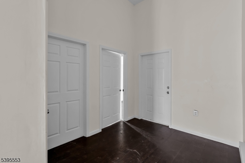 932 Wheatsheaf Road Roselle, NJ 07203 - Photo 27 of 44 an empty room with wooden floor